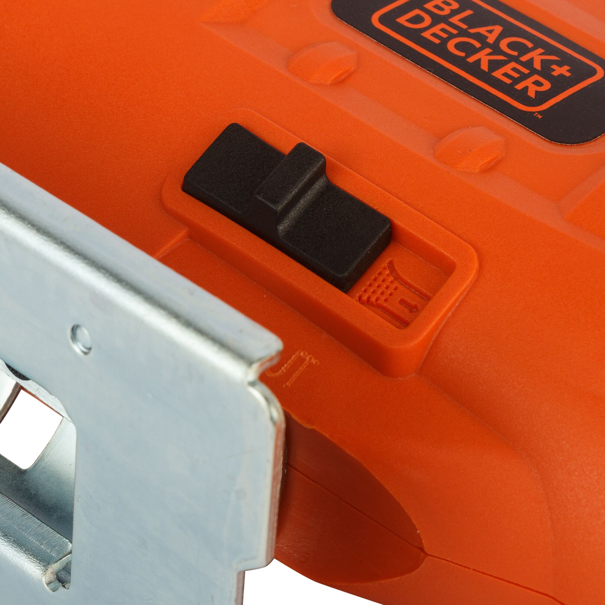 BLACKDECKER JS20 jigsaw switch and base close-up, orange body, photography with white background